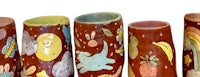 a row of vases with different designs on them